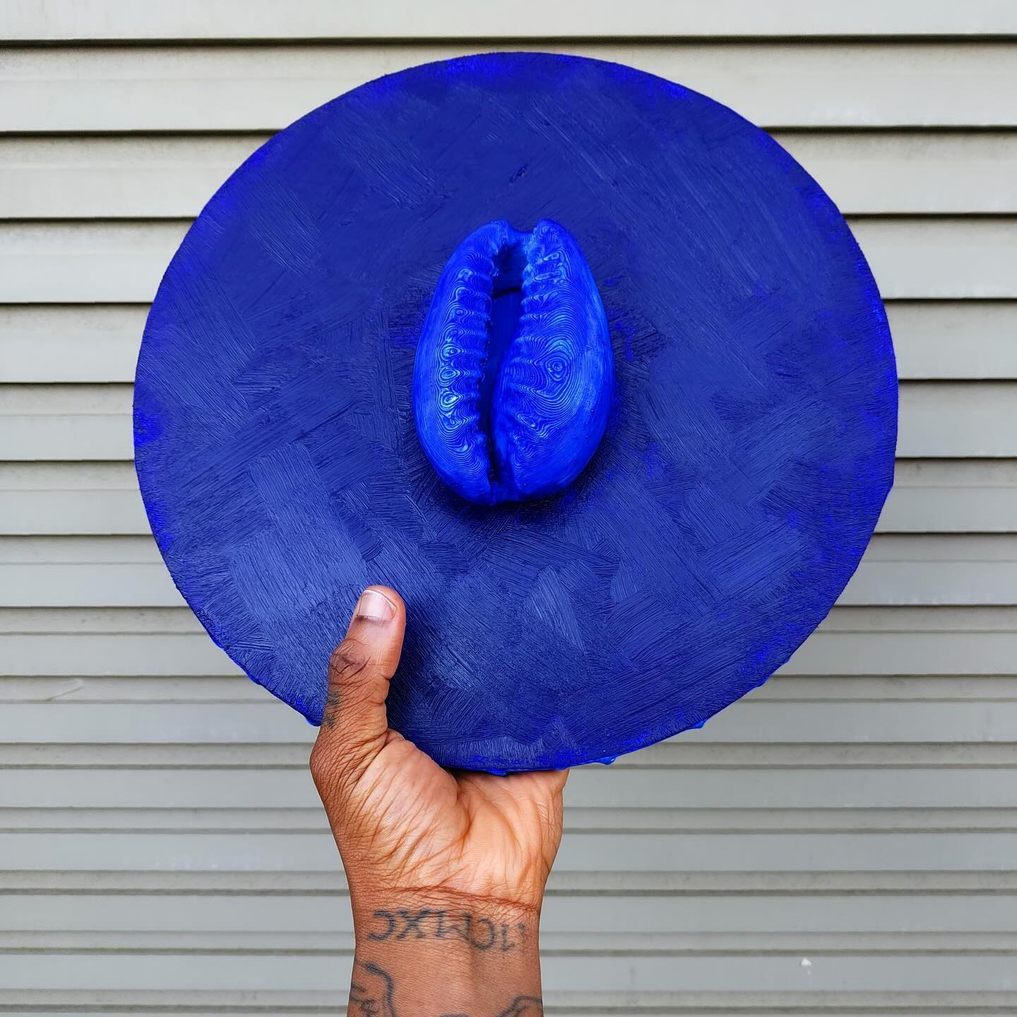 3D-printed cowrie-shaped artifacts blending ancient symbolism with modern design